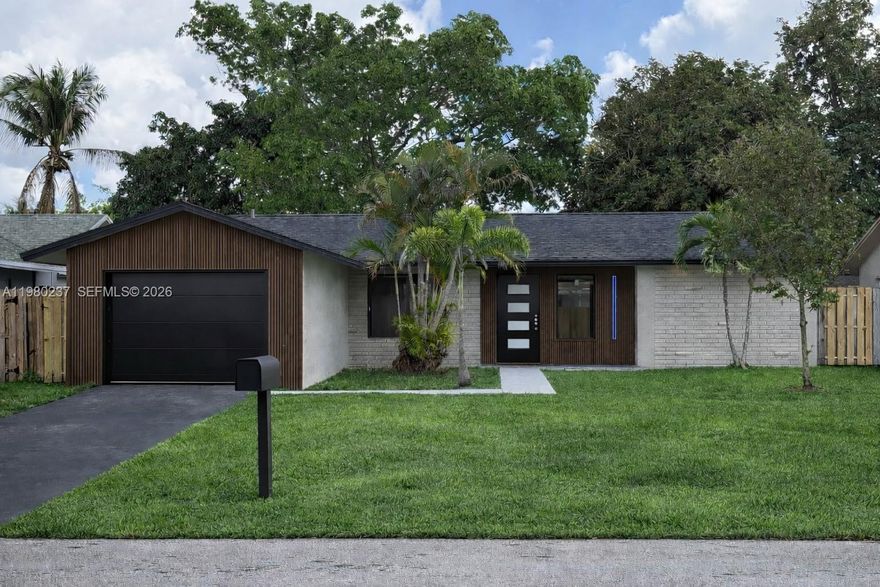 Completely remodeled and move-in ready 3-bedroom, 2-bathroom home in Sunrise! This beautifully updated property features a brand-new roof, impact windows, and a modern open layout with abundant natural light. The stunning new kitchen offers elegant Calacatta quartz countertops and a matching quartz backsplash, perfect for both everyday living and entertaining. Both bathrooms have been fully renovated with contemporary finishes. Designed with a fresh, modern style throughout, this home feels brand new and is ready for its next owner. A true turnkey opportunity—just bring your furniture and move in!