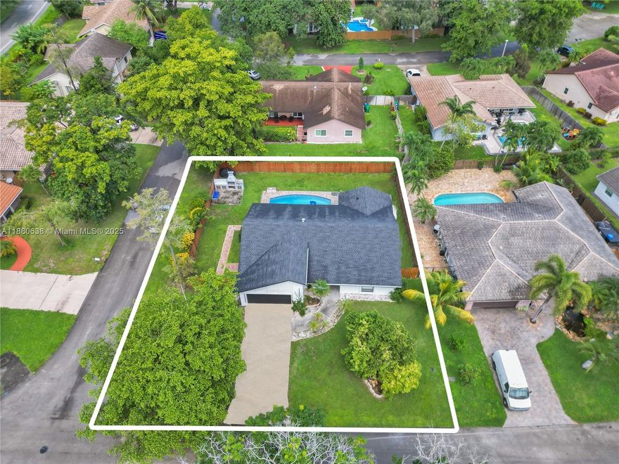 This home has it all and a BRAND NEW ROOF. Vaulted ceilings in Living room & Family room with formal dining room. Exterior painted (2025) & Interior (2024). Waterproof vinyl flooring installed (2024) with large 6" Baseboards.  Quartz in kitchen, designer light fixtures installed with dimmer switches throughout (January 2025).  Nest Thermostat, Tankless water heater (2019), A/C (2022), Full set of hurricane shutters. Gutters on exterior (2025) and pool pump replaced 6 years ago. Corner lot w/ shadowbox privacy fence has 12ft gate, amazing backyard space with heated pool, and built-in Argentinian grill that has 3 storage bins perfect for gatherings. Front driveway has parking for 5 cars plus a 2 car garage. Ideal Location blocks from Several parks, shopping areas, Seminole Casino and more.