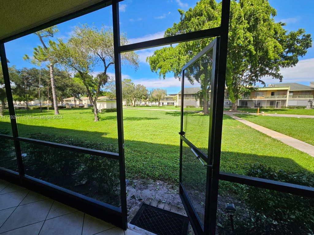 Photo of 4123 NW 88th Ave #104, Coral Springs, FL 33065 (MLS # A11702521)