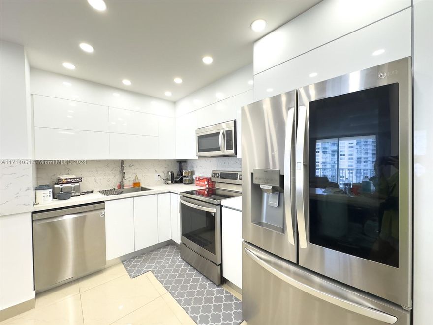 Discover luxurious, resort-style living in the heart of Aventura! This spacious, remodeled 2-bedroom, 2-bathroom condo offers the best line in the building, boasting breathtaking water views of Maule Lake and the Ocean. The unit features modern, high-end finishes, new kitchen including sleek granite countertops, stainless steel appliances, and stylish bathrooms. Enjoy the exclusive amenities, including two pools with updated decks, tennis courts, a fitness center, a park, and 24-hour security. Conveniently located, you can walk to a nearby shopping center, Williams Island, and much more. For those seeking a vibrant community, the Lubavitch Aventura Synagogue and Chabad Center are right next door, with building access provided. This is Aventura living at its finest – don't miss out!
