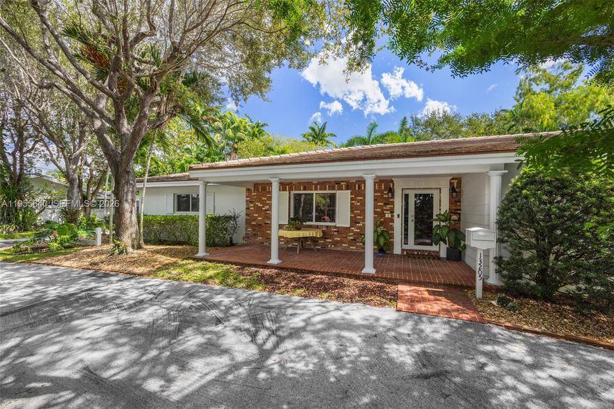 Set within one of Pinecrest’s most desirable neighborhoods, this timeless canal-front residence offers a rare blend of Old Florida charm and modern upgrades on a beautifully landscaped 15,028 SF lot. A sweeping tree canopy and deep front porch welcome you into light-filled interiors, where a thoughtful split floor plan balances privacy and flow. The expansive family room connects seamlessly to a generous eat-in kitchen with wide sliding glass doors that open to a screened pool and patio—perfect for entertaining or enjoying peaceful mornings with tranquil water views. Impact windows and doors, paired with classic shutters, provide both security and character. The circular drive leads to a spacious side-entry garage with ample room for a boat or RV, catering to an active lifestyle. With direct canal access to Lake Sheldon, this home is ideal for boating, fishing, or simply embracing nature. Located within the top-rated Palmetto school district, this is Pinecrest living at its finest.