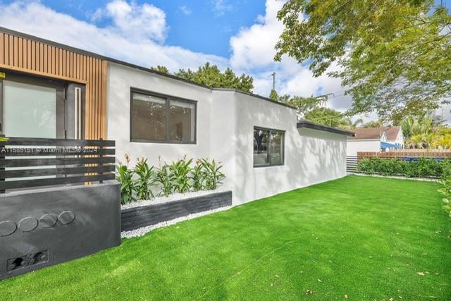 Totally remodeled nice and large single family home for yearly rent in the very well known trendy and historical area "Design District". High end furniture. Large 3/2 +Den. Garden. Close to great schools. 10mn from the beach. from Downtown, from the Miami International Airport. This will be the perfect home for demanding tenants. Easy showing.