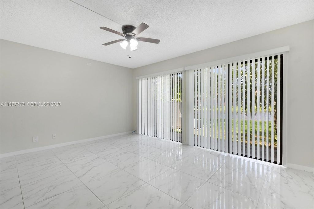 Photo of 9827 NW 37th St #4F, Sunrise, FL 33351 (MLS # A11977319)