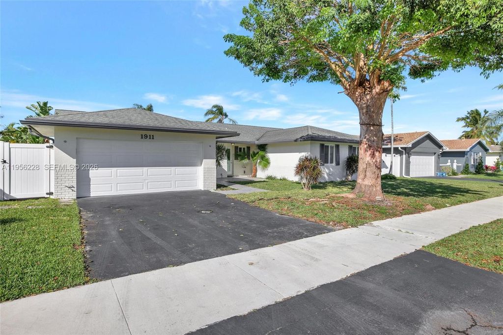 Photo of 1911 NW 40th Ct, Oakland Park, FL 33309 (MLS # A11956228)