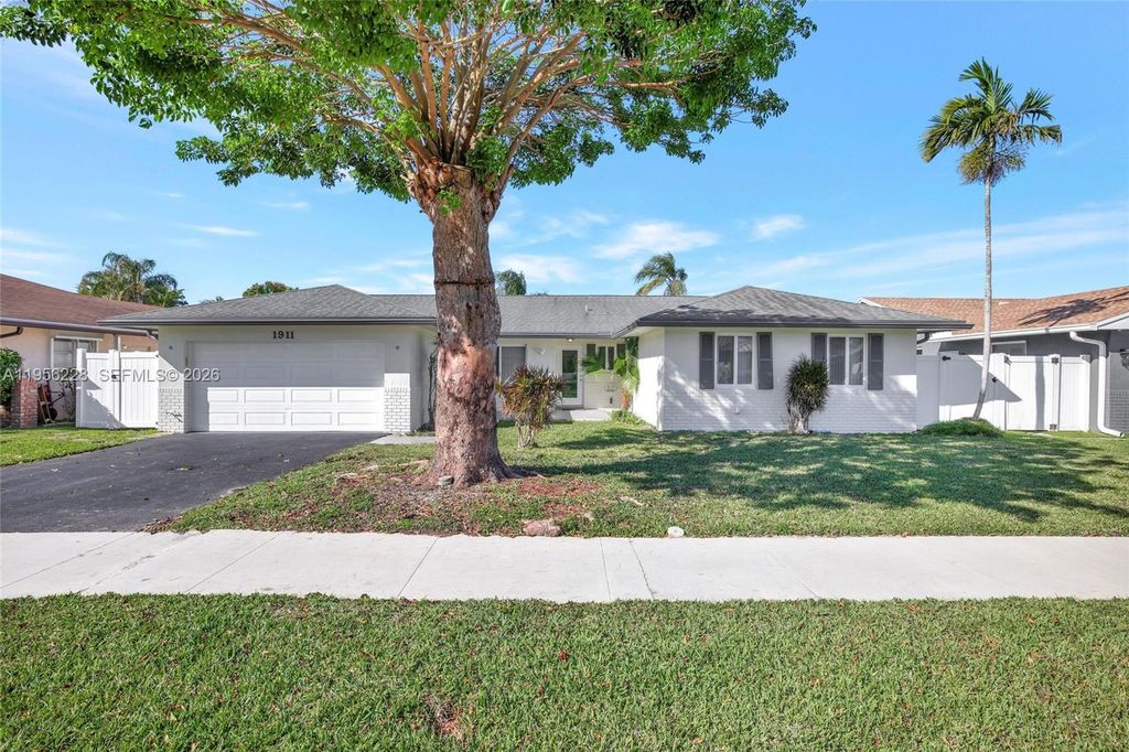 Photo of 1911 NW 40th Ct, Oakland Park, FL 33309 (MLS # A11956228)