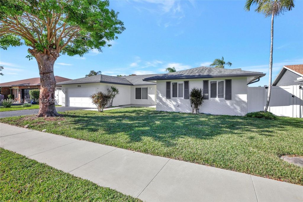 Photo of 1911 NW 40th Ct, Oakland Park, FL 33309 (MLS # A11956228)