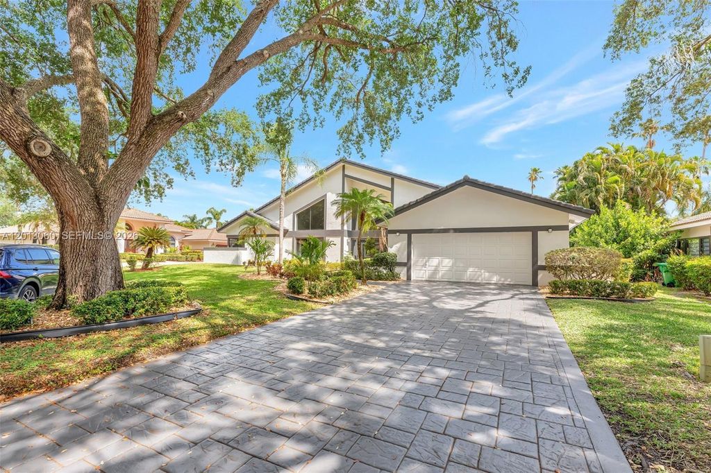 Photo of 10325 NW 6th St, Coral Springs, FL 33071 (MLS # A12013060)