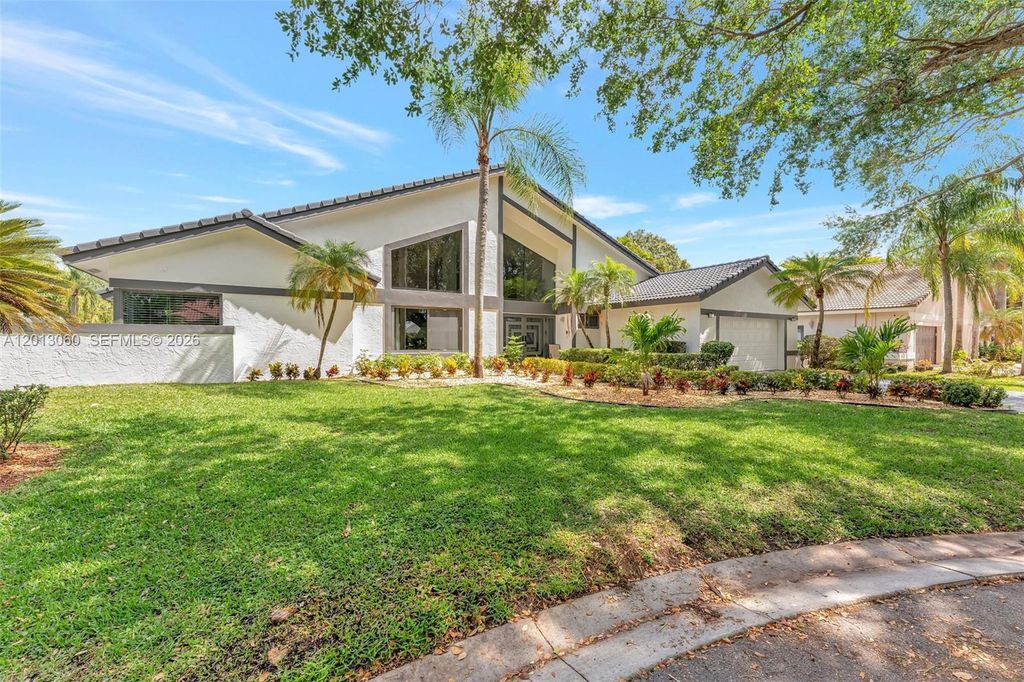 Photo of 10325 NW 6th St, Coral Springs, FL 33071 (MLS # A12013060)