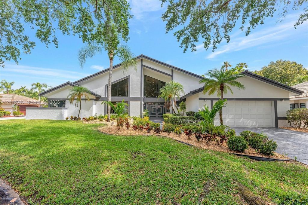 Photo of 10325 NW 6th St, Coral Springs, FL 33071 (MLS # A12013060)