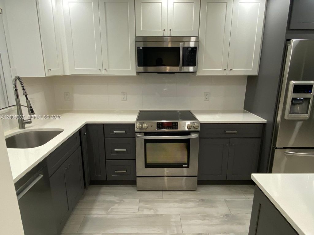 Photo of 660 Tennis Club Dr #205, Fort Lauderdale, FL 33311 (MLS # A12005082)