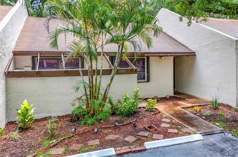 Photo of 1571 NW 96th Way, Pembroke Pines, FL 33024 (MLS # A12022567)