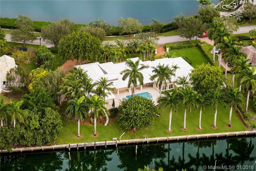 Perfectly positioned in the prestigious and private Gables Estates, this sophisticated timeless style estate commands 200 waterfront ft. With front and back water-views, volume ceilings, five bedrooms, 6 bathrooms plus one guest bath. Formal living and dining areas. Gourmet kitchen. Finishes throughout includes marble floor in living areas and wood floors in bedrooms. Covered patio, great for entertaining. Two car garage. Private dock with direct ocean access.