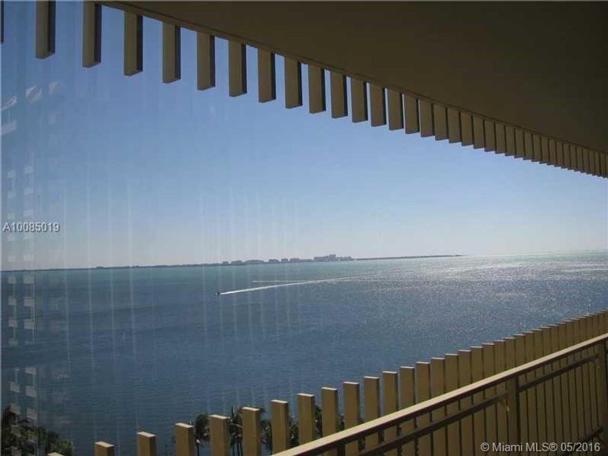 Enjoy the fascinating east open bay view from this large 2 bedroom 2 full bath unit in Grove Isle. A private community with a tennis club, marina, restaurant, pool, and private beach on site. Open kitchen, marble in the living areas and carpet in the bedr ooms. Large walk in closet. These units are rarely available. Call for a private showing.