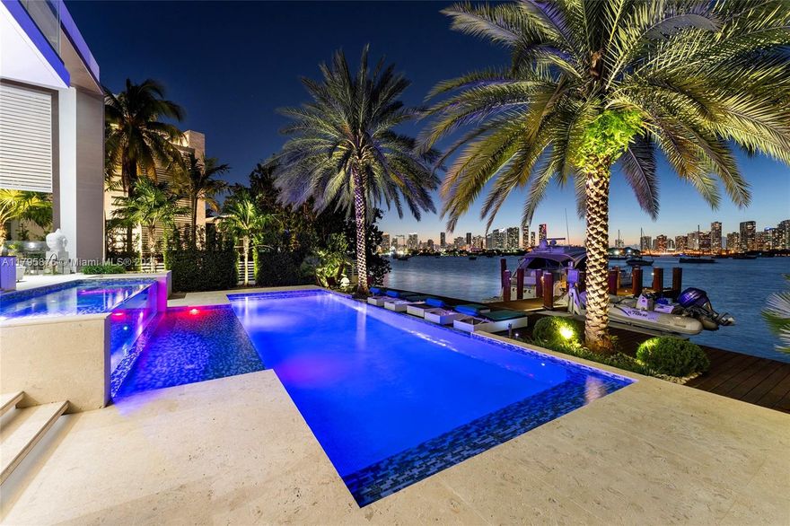 This spectacular contemporary tri-level waterfront home is located on the tip of guard-gated Hibiscus Island featuring a rooftop entertainment lounge & the best open bay & Miami skyline views on Miami Beach. The 5BR/6+1BA home boasts marble & hardwood floors, soaring ceilings, fine designer finishes, floor to-ceiling windows, sleek chef’s kitchen w/top-of-the line appliances, & expansive living/entertainment areas w/amazing water views. 2nd level principal suite w/private terrace facing the bay, & spa-inspired marble bathroom & large walk-in closet. 3rd level rooftop lounge made to relax & enjoy sunsets over the bay & Miami skyline. The outdoor spaces offer covered seating areas, summer kitchen, pool w/waterfall, cabana bath, large dock & Ocean access.