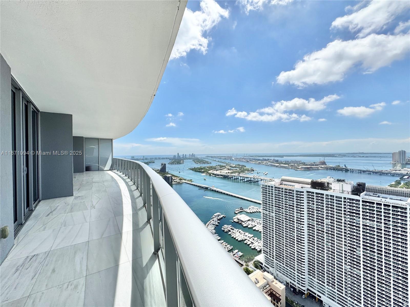 Live in luxury at Aria on the Bay in this stunning 3-bedroom, 3.5-bath residence on the 49th floor with breathtaking bay and city views. Featuring floor-to-ceiling windows, 10’ ceilings, marble floors in the living area, wood floors in bedrooms, and 300+ sq. ft. of balcony space. The European-style kitchen includes Bosch appliances, sleek cabinetry, and quartz countertops, complemented by custom-built closets and designer finishes. Unit comes with 2 Tandem parking spaces.
Enjoy resort-style amenities: sunrise and sunset pools, rooftop Jacuzzi, spa, sauna, fitness center, yoga studio, theater, lounge, business center, and kids’ playroom. Perfectly located in Edgewater, steps from Margaret Pace Park and minutes to Wynwood, Design District, Brickell, Downtown, and South Beach.