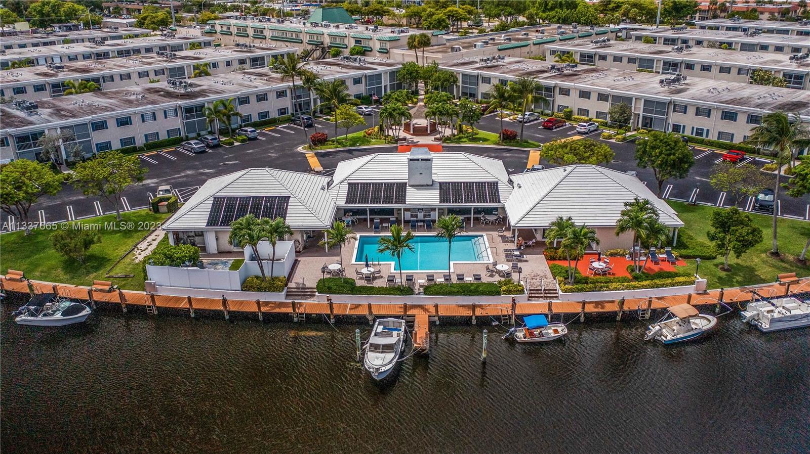 The Ideal Pied-A-Terre in Pompano Beach Florida. Live the Florida lifestyle at this waterfront location. This spacious 1 bedroom with updated 1.5 Bathrooms unit is move-in ready. It has an open concept living-dining area, updated kitchen with newer SS appliances and screened-in patio. The AC was updated in 2022. There is an sizeable store room for all your extra travel items and beach gear. The community boasts an expansive waterfront area. You may rent a dock - subject to availability. Ocean access with fixed bridges. Amenities include a heated pool, clubhouse and fitness center. Pet friendly with 1 pet up to 15lbs. May rent after 2yrs ownership. Quick access to beautiful beaches. Close to dining, shopping and entertainment! Don't miss out on this gem. See it today!