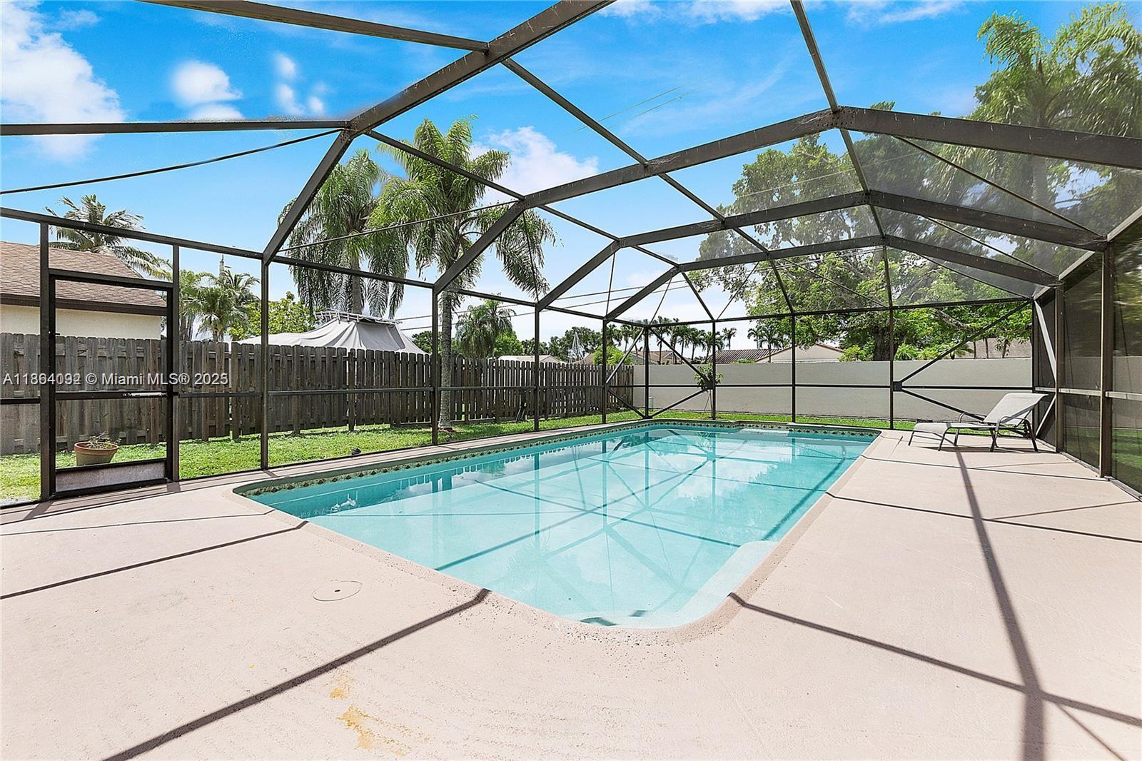 Opportunity to rent a beautifully updated single-family home in Cooper City, one of Broward’s most sought-after neighborhoods. This 3-bedroom, 2-bath property features a new roof, fresh paint, updated tile flooring throughout, and a modern kitchen. The layout offers privacy with a split floor plan—two bedrooms and a bath on one side, and a large master suite on the other. Enjoy a heated pool under a covered patio, a private backyard with palm trees and young mango trees, plus a 2-car garage. Located in an excellent school district and a quiet, family-friendly area.