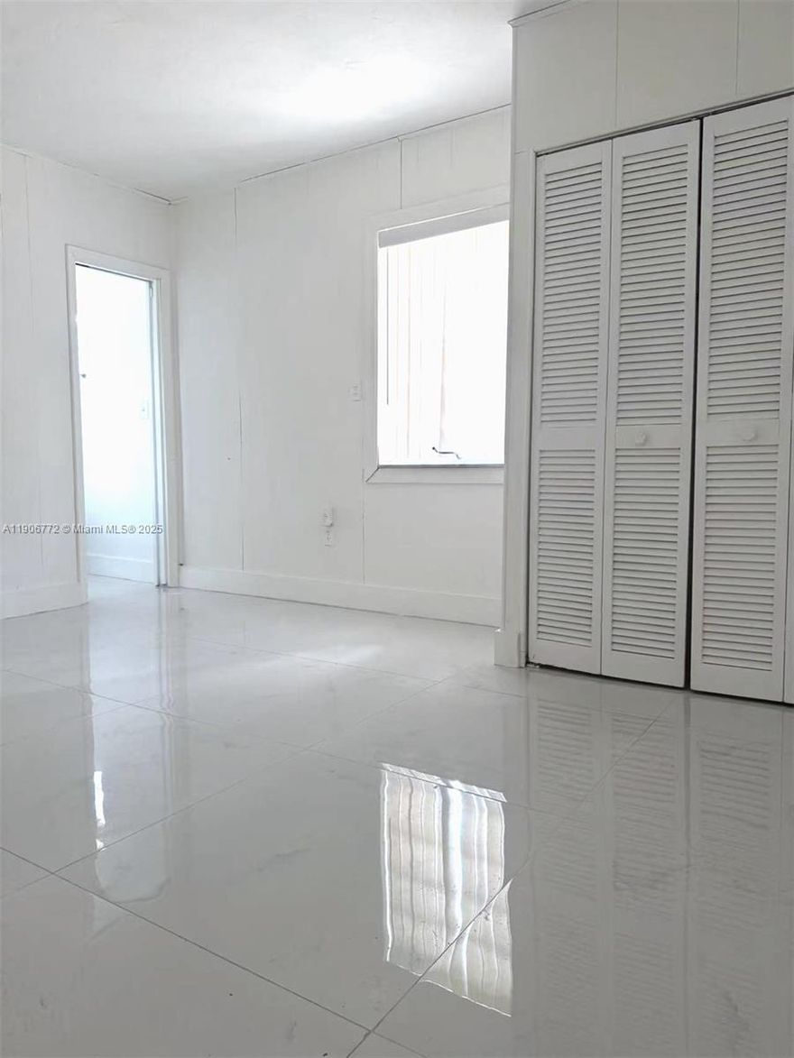 Rental price this good won't last long! Cozy 3/2 unit in the heart of Miami. Completely remodeled. New bathroom. Tile floor throughout the unit. Freshly painted. Unit shares washer and dryer with landlord and other unit tenant. Front yard fenced parking and street parking. Close to everything. $300 monthly utility fee, included water, electricity, and internet. This is at the back of the house. Easy to show!