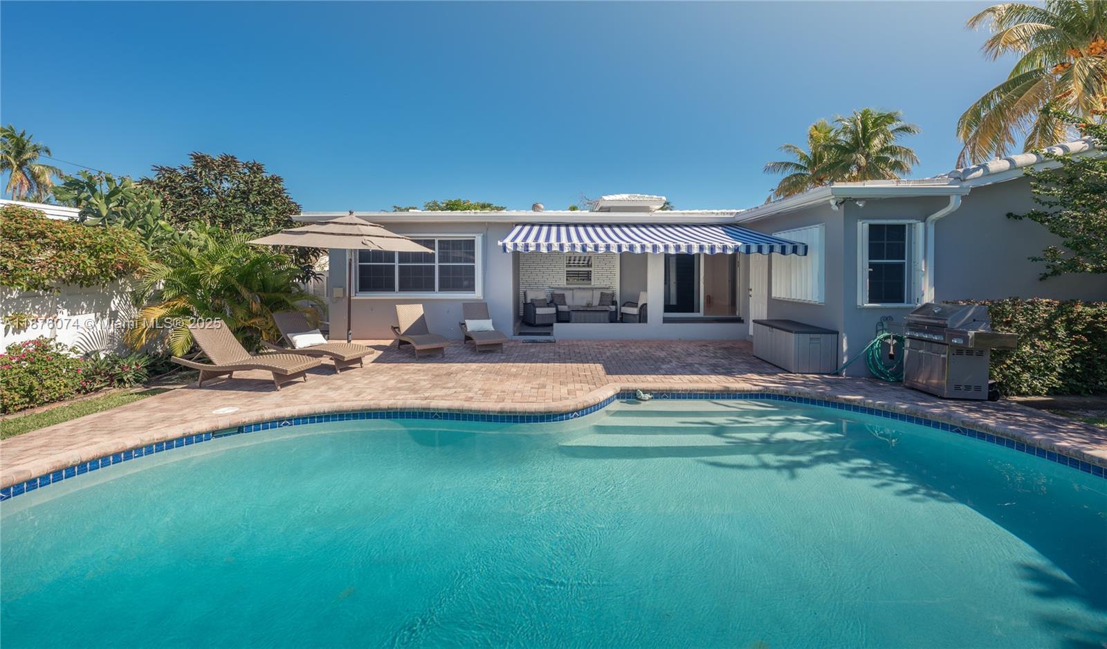Don't miss out on the opportunity to live in this cozy 4/2 single home with beautiful large heated pool, outdoor sitting area covered by motorized awning, well manicured back yard and one car garage. House located in the upscale Hollywood Hills neighborhood in close proximity to major roads. Property is featuring impact windows and doors for extra protection and being offered TURN KEY FULLY FURNISHED.