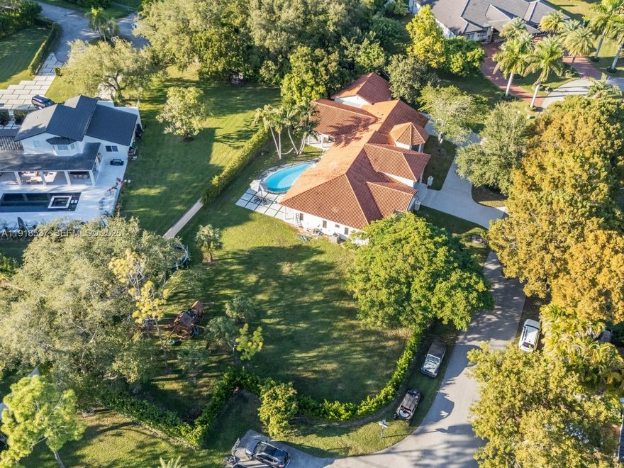 3,932 square feet of pure living area! (More than tax roll) Imagine coming home to a warm-modern 6-bed, 6-bath home on a private 29,000 sqft lot, straight out of a Pinterest board. Completely redesigned and remodeled, this home has everything you could want! The chef's kitchen features custom wood cabinetry with brass accents, a curved industrial-scale hood, leathered stone, luxury appliances and a butler's pantry right behind perfect for any soiree! The primary suite is a serene retreat comprised of beautiful millwork, his and hers California closets, french doors to the pool area and a spa-inspired bath. The split layout conveniently includes 4 beds and 3 baths on one end of the house while the other wing includes the office room, playroom/den and private bedroom suite ideal for guests. Impact and UV-filtered windows/doors fill the home with natural light while keeping it private and secure. Integrated sound system throughout the home and terrace make for effortless gatherings. Outside you'll find the refreshed pool, lush landscaping, convenient cabana bath and expansive yard with room to build the court of your dreams. 2 car garage for ample storage and large circular driveway. Updated plumbing and electrical. Sits on a quiet U street providing extra privacy. Come experience Palmetto Bay living! Move in ready... just bring your golf cart!