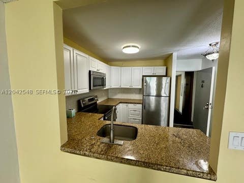 Tiny photo for 2029 NW 46th Ave #E202, Lauderhill, FL 33313 (MLS # A12042548)