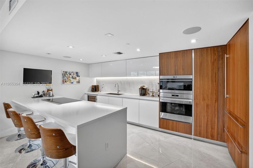 Exceptional value opportunity. All offers requested by 2/8/26. Experience refined beachfront living in a beautifully designed residence within one of Fort Lauderdale’s premier oceanfront buildings. This spacious unit offers a modern open layout filled with natural light, ideal for both everyday living and entertaining. Thoughtful finishes and generous living areas create a calm, coastal retreat just steps from the sand.
The residence features Italian-designed kitchens and baths by Italkraft, quartz countertops, and marble flooring throughout. The chef’s kitchen is equipped with Sub-Zero refrigeration, Wolf cooktop, oven, and microwave, plus Bosch dishwasher and ventilation. Spa-inspired baths include Grohe shower fixtures and Duravit toilets. Hurricane-impact, floor-to-ceiling windows and doors provide security and abundant natural light, while electric window treatments with remote controls offer effortless comfort and privacy.

A rare feature that sets this unit apart is its private side stairway access, allowing easy in-and-out entry and enhanced privacy with a townhome-like feel.
Residents enjoy resort-style amenities including an amenity floor with coffee and newspaper lounge, steam room, massage room, men’s and women’s saunas and showers, yoga studio, fitness center with Peloton area, barbecue area, and an oceanfront infinity pool with hot tub, cabanas, and daily beach service. Additional features include temperature-controlled storage and 24-hour concierge service.