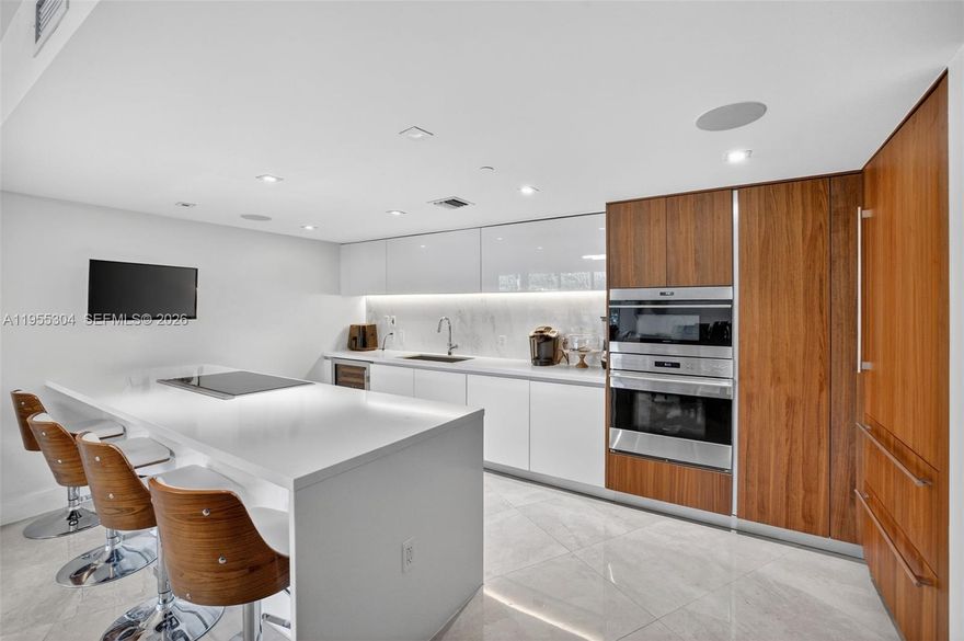 Exceptional value opportunity. All offers requested by 2/8/26. Experience refined beachfront living in a beautifully designed residence within one of Fort Lauderdale’s premier oceanfront buildings. This spacious unit offers a modern open layout filled with natural light, ideal for both everyday living and entertaining. Thoughtful finishes and generous living areas create a calm, coastal retreat just steps from the sand.
The residence features Italian-designed kitchens and baths by Italkraft, quartz countertops, and marble flooring throughout. The chef’s kitchen is equipped with Sub-Zero refrigeration, Wolf cooktop, oven, and microwave, plus Bosch dishwasher and ventilation. Spa-inspired baths include Grohe shower fixtures and Duravit toilets. Hurricane-impact, floor-to-ceiling windows and doors provide security and abundant natural light, while electric window treatments with remote controls offer effortless comfort and privacy.

A rare feature that sets this unit apart is its private side stairway access, allowing easy in-and-out entry and enhanced privacy with a townhome-like feel.
Residents enjoy resort-style amenities including an amenity floor with coffee and newspaper lounge, steam room, massage room, men’s and women’s saunas and showers, yoga studio, fitness center with Peloton area, barbecue area, and an oceanfront infinity pool with hot tub, cabanas, and daily beach service. Additional features include temperature-controlled storage and 24-hour concierge service.