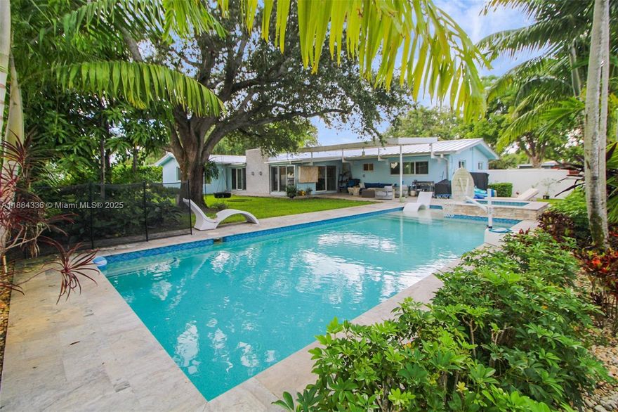 Renovated 4-bed, 3-bath home on an oversized 15,000 SF corner lot w 2 car garage in desirable Miami Springs. Heated 40’x15’ pool w spa on travertine decking. Custom putting/chipping green by Celebrity Greens.  Impact windows and doors, metal roof, updated plumbing and electrical panels, acacia hardwood and tile flooring.  Custom kitchen w quartzite countertops, and Thermador appliances -induction cooktop, three ovens, microwave, warming drawer, and wine cooler. New AC and water heater & insulated attic. New stucco and paint. Camera & security system. PVC fencing with pedestrian and auto access, sprinkler system on well, and buried electric lines. Miami Springs is a hidden gem of a neighborhood, great for families with plenty of activities and charm.
