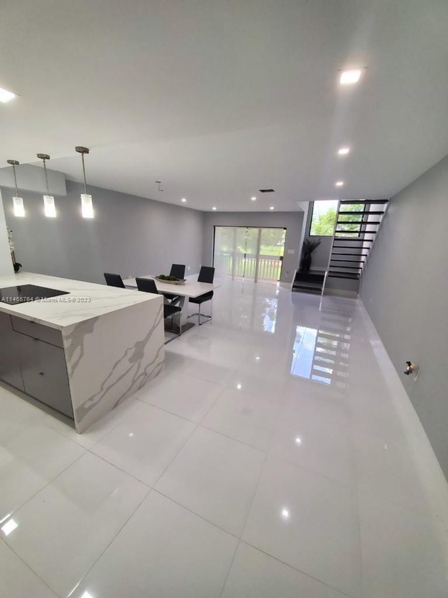 Location, Location, Location! This is a beautiful townhouse with two bedrooms that includes a huge master with a big walk-in closet. There is a storage downstairs, guest bath, washer and dryer inside the unit. Elegant ceramic at first floor and modern appliances. Laminated second floor. Balcony overlooking the lake and Golf Course. Small patio at front. Located in the Fontainebleau neighborhood, very close to FIU, International and Dolphins Mall, fast access to the Turnpike and other expressways, etcetera.