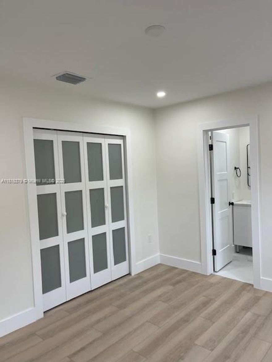 Completely remodeled 4 Bedroom 2 Bath rear duplex with a patio.  3 parking spaces