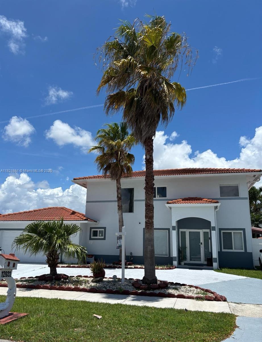 Come see this beautiful 2-story single-family home featuring 4 bedrooms and 3 full bathrooms, complete with a sparkling pool! This spacious and well-maintained home offers bright natural light throughout, creating a warm and inviting atmosphere. It features impact windows, a recently upgraded kitchen, porcelain tile flooring, and a central A/C system that's less than 4 years old.: Seller to credit buyer up to $1500 for new washer/dryer.
Elegant French doors open directly to the backyard oasis—perfect for entertaining or relaxing by the pool. The garage has been converted into a private efficiency unit with its own entrance, ideal for guests, extended family, or rental income. Schedule your showing soon—Welcome home!