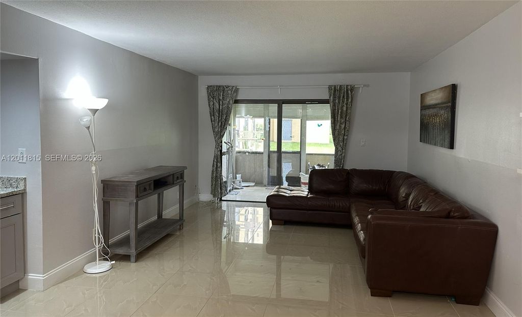 Photo of 9370 SW 8th St #107, Boca Raton, FL 33428 (MLS # A12011815)