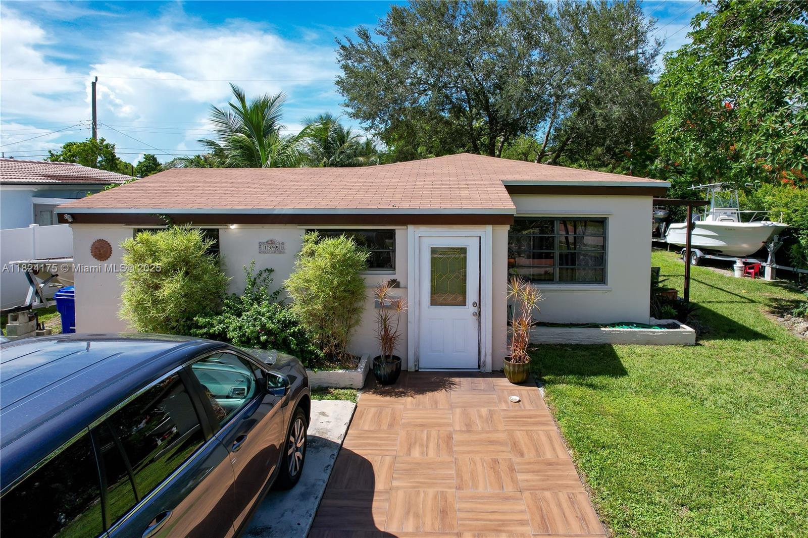 Located on a desirable corner lot in North Miami Beach, this charming 1,836 sqft home of living space offers comfort, privacy, and convenience. Featuring a 4-year-old roof and AC, tile flooring throughout with vinyl in the bedrooms, and a gas stovetop in the main kitchen. An additional kitchenette in the rear adds flexibility. Enjoy a spacious living area, perfect for relaxing or entertaining. Walking distance to multiple houses of worship, with nearby parks, golf course, and public transportation. Just a 10-minute drive to world-renowned Aventura Mall and only 15 minutes from the beaches. Quick access to I-95 makes commuting a breeze. Don’t miss this opportunity to live in the heart of it all!