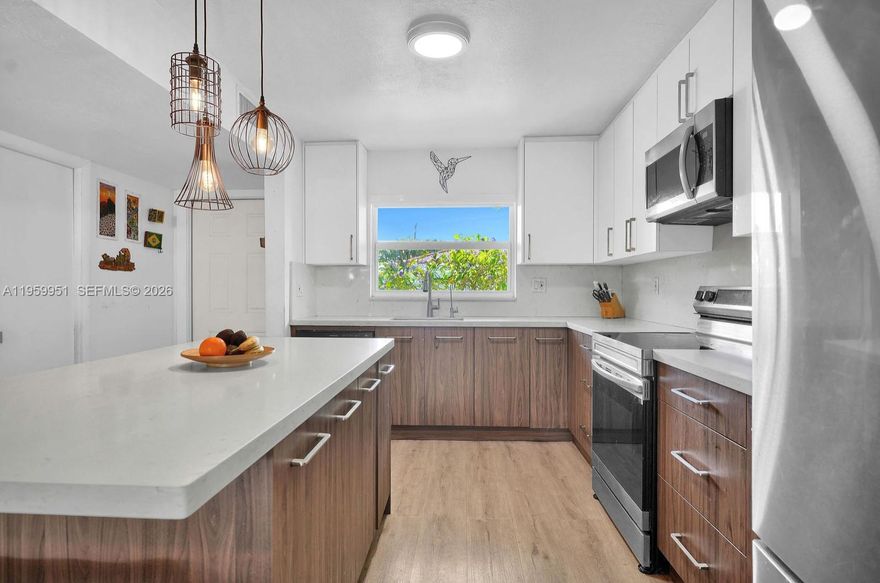 AMAZING TOWNHOUSE in an unbeatable location - Live the sought-after San Souci Lifestyle in this spacious 2-bedroom, 2.5-bath townhouse offering approximately 1,548 sq ft (145 m²) of living space in North Miami with the Bay at the end of the street. Ideally located just one block from the Broad Causeway, with quick access to Miami Beach (Beaches), Bal Harbour (Shops), Whole Foods, Publix, LA Fitness, HomeDepot, restaurants, and parks. Situated in a quiet, well-maintained community with a manicured front yard. New A/C system, Hurricane-proof windows, and new flooring throughout add comfort and value. Walking distance to houses of worship. Perfect for your family. A rare opportunity combining location, lifestyle, and convenience—truly a must-see.