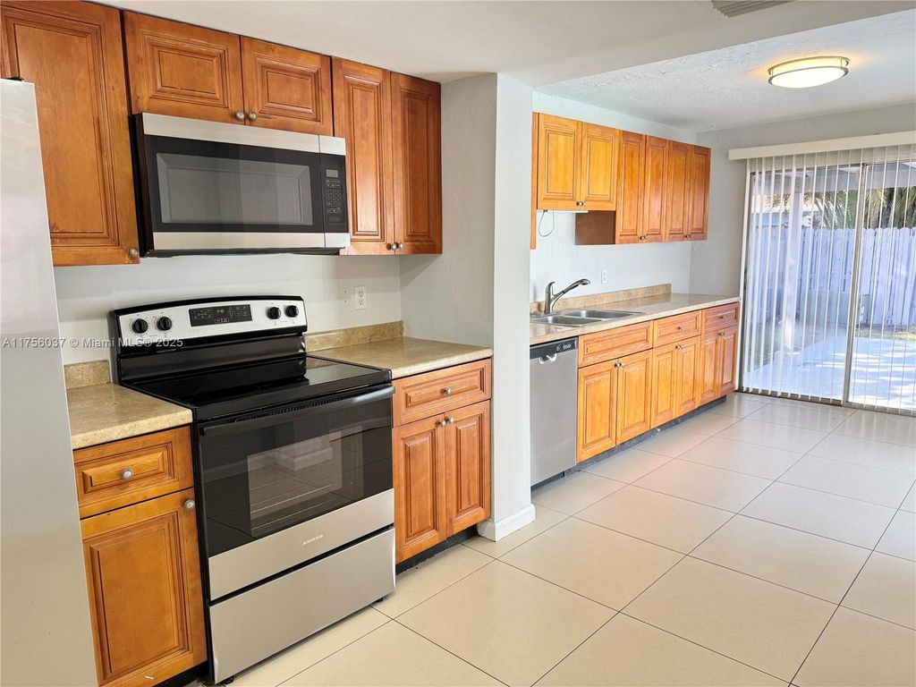 Photo of 11001 NW 20th Ct, Sunrise, FL 33322 (MLS # A11756037)