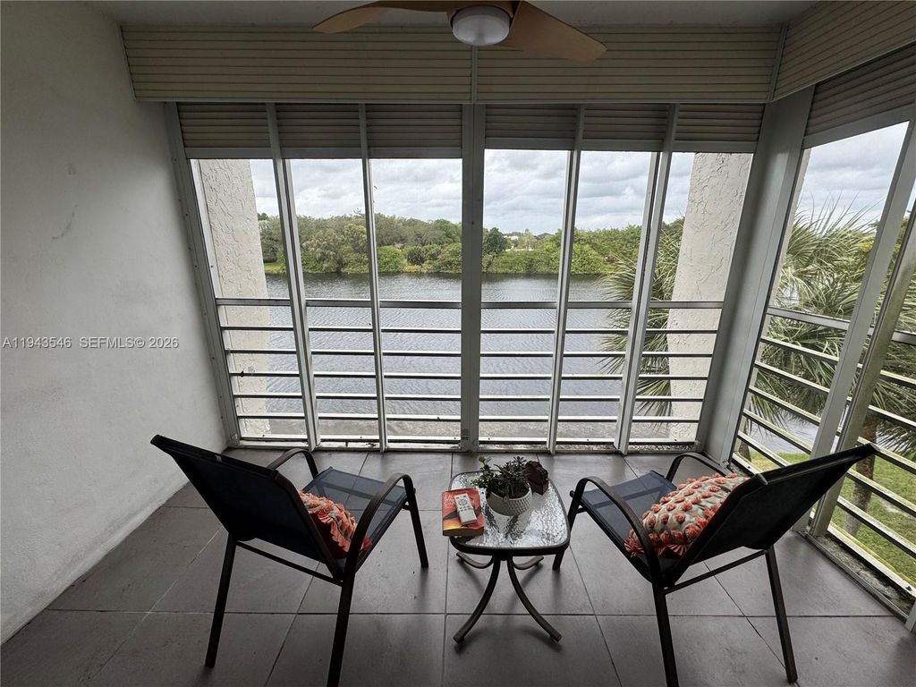 Photo of 9450 Poinciana Pl #405, Davie, FL 33324 (MLS # A11943546)