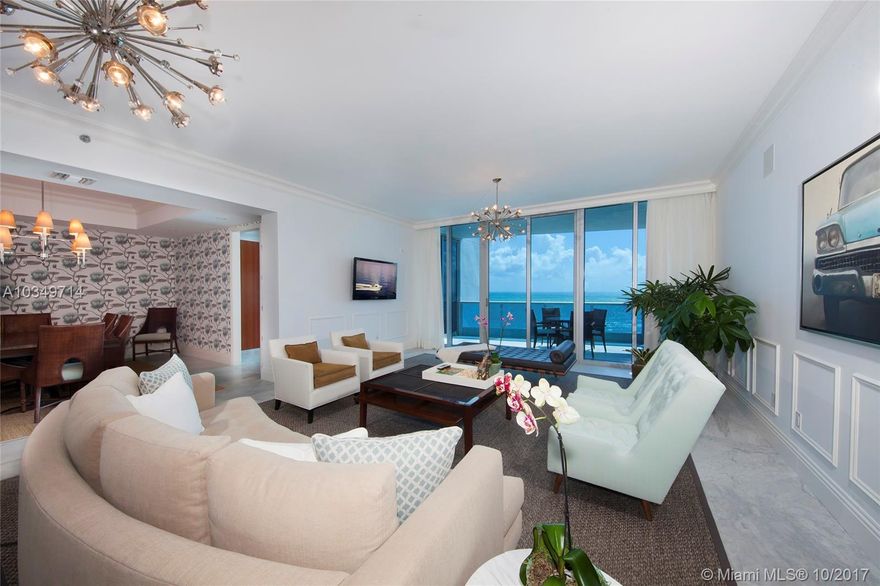 This contemporary residence at the exclusive Bath Club features exquisite Carrara marble floors, high ceilings & 3,982 SF of luxury. Spacious living room & elegant dining room w/ beach & ocean views, plus media room & office/den space. Open gourmet kitchen w/top of the line Miele appliances, Corian center island & counter tops & separate breakfast area. Sumptuous master suite is entered through double doors, full his & hers walk-in closets w/built-ins & step-out access to terrace with unobstructed beach & ocean views. Master bathroom features double sinks, walk-in glass/marble rain shower, spa tub & private water closet.  Enjoy the sunrise & sunset from 2 expansive terraces – One faces East w/direct views to beach & Atlantic Ocean. Second faces West with city, bay & downtown views.