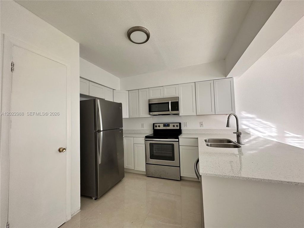 Photo of 480 NW 42nd Ct #2, Deerfield Beach, FL 33064 (MLS # A12022988)