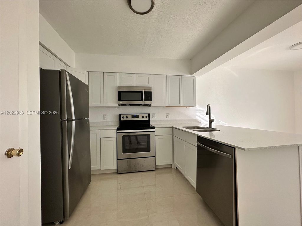 Photo of 480 NW 42nd Ct #2, Deerfield Beach, FL 33064 (MLS # A12022988)