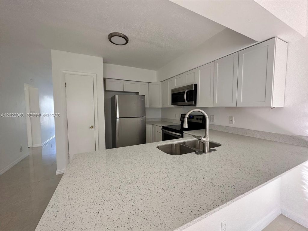 Photo of 480 NW 42nd Ct #2, Deerfield Beach, FL 33064 (MLS # A12022988)