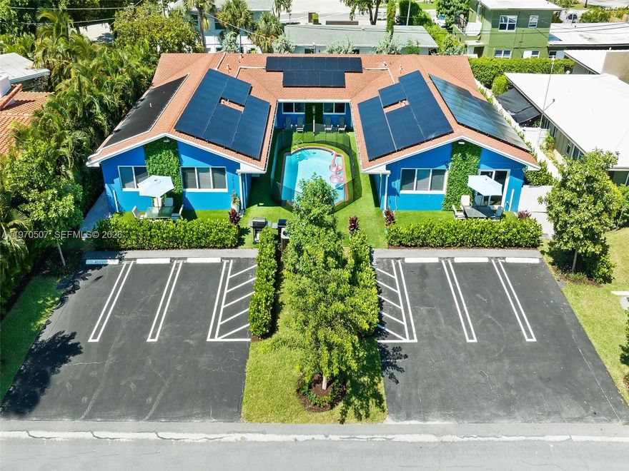 Prime beachside investment opportunity in exclusive Hillsboro Shores, just east of A1A.This fully renovated fourplex features four spacious 2BR/2BA units, each with private laundry, patio space, and separate electric meters. Impact windows throughout provide peace of mind, while solar panels power the entire property for enhanced efficiency.

Set on a nearly 10,000 SF fenced lot with lush tropical landscaping, the property offers a heated pool, sun deck, and barbecue area with artificial turf—creating a true resort-style atmosphere guests love. Currently operating as a high-performing short-term rental with 5-star reviews and reservations in place, this turnkey opportunity comes fully furnished and equipped. All required short-term rental licenses are active and ready to continue operations immediately.

Concrete block construction, shingle roof, central A/C, auto sprinkler system, and six parking spaces add to the property’s strong fundamentals. Whether you’re seeking consistent cash flow, a vacation rental portfolio addition, or a long-term hold in one of Broward’s most desirable beachside communities, this property delivers location, upgrades, and income potential in one package.

Minutes from dining, shopping, and the sand—beach living that guests return to year after year.