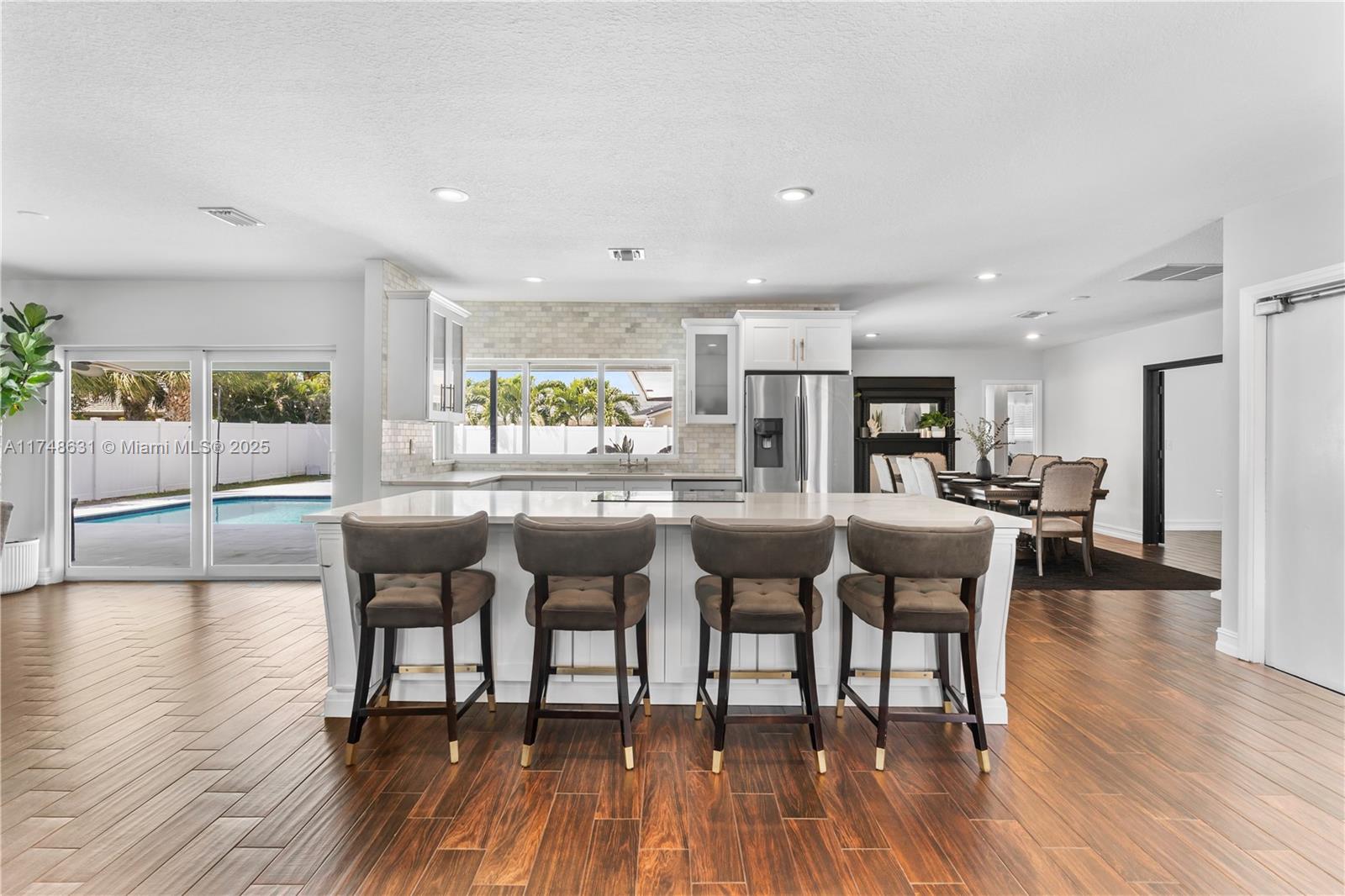 Experience modern luxury in this completely remodeled home in the heart of Boca Raton. Every detail has been meticulously upgraded, from the brand-new metal roof, gutters, and hurricane-impact windows to the sleek new garage door, fence, and pool deck finished with honed white marble.
Step inside to discover an elegant interior featuring all-new bathrooms, high-end flooring, and a designer kitchen with pristine white quartz countertops.
For wellness enthusiasts, the garage boasts a private sauna and cold plunge, offering the perfect retreat after a long day. With top-rated schools, premier shopping, and the vibrant Mizner Park just minutes away, this move-in-ready gem is an exceptional find.
Don't miss your chance to own this exquisite Boca Raton home—schedule your showing today!