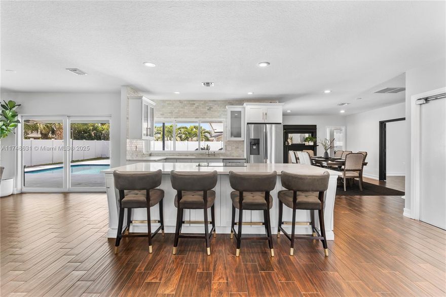 Experience modern luxury in this completely remodeled home in the heart of Boca Raton. Every detail has been meticulously upgraded, from the brand-new metal roof, gutters, and hurricane-impact windows to the sleek new garage door, fence, and pool deck finished with honed white marble.

Step inside to discover an elegant interior featuring all-new bathrooms, high-end flooring, and a designer kitchen with pristine white quartz countertops.

For wellness enthusiasts, the garage boasts a private sauna and cold plunge, offering the perfect retreat after a long day. With top-rated schools, premier shopping, and the vibrant Mizner Park just minutes away, this move-in-ready gem is an exceptional find.

Don't miss your chance to own this exquisite Boca Raton home—schedule your showing today!