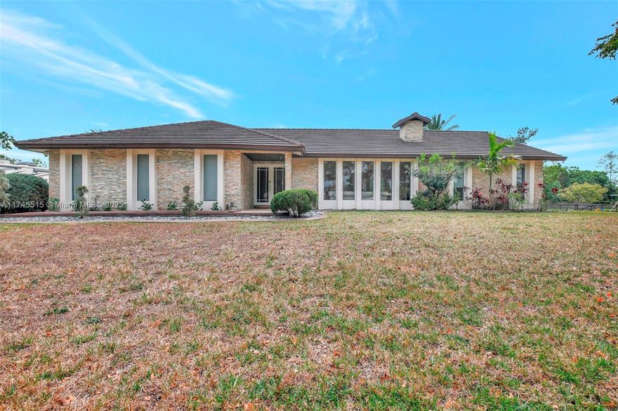 Horse country paradise in Southwest Ranches.  Totally upgraded 3/2 Ranch style home on 1.9 Acres of land with no HOA obligations.  Very large heated pool and full basketball court.  The house has a 7 year-old roof with two new AC units, tankless water heater, impact windows and doors, security cameras, slate floor in the garage and a fireplace. Tile flooring throughout. SW Ranches is known for its Equestrian atmosphere and with your two horse stalls you can become part of a community that keeps a rural flavor and have all the space you need for your dogs (They have their own AC Dog House) and farm animals. Rolling Oaks, where your future home is located is just minutes from multiple shopping and dining opportunities.