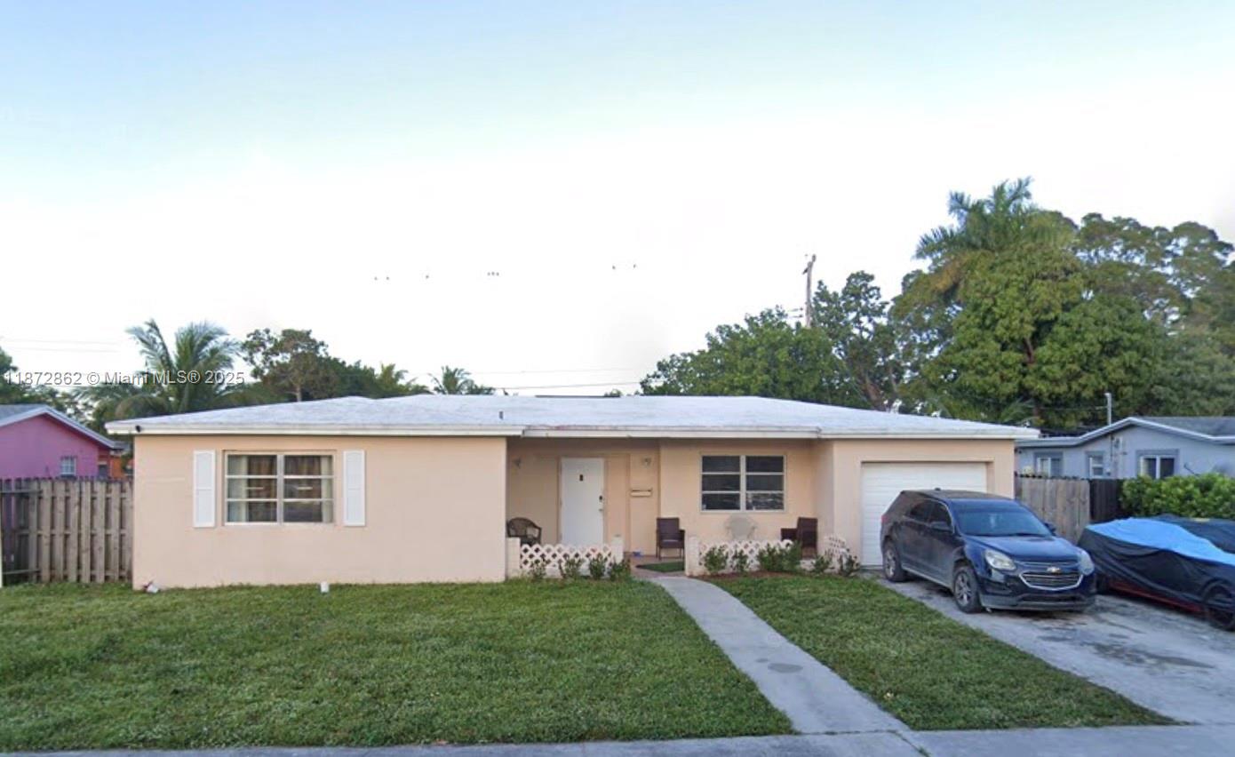 Discover the potential of this home nestled in the quiet neighborhood of Oriole Estates in Lauderdale Lakes. This 3 bedroom, 2 bath property with a 1-car garage boasts a spacious layout with great natural light and a large, fenced-in backyard perfect for entertaining or relaxing outdoors. With the ability to create additional living spaces, this property offers great flexibility. It presents a great opportunity for a primary residence or a solid long-term investment.