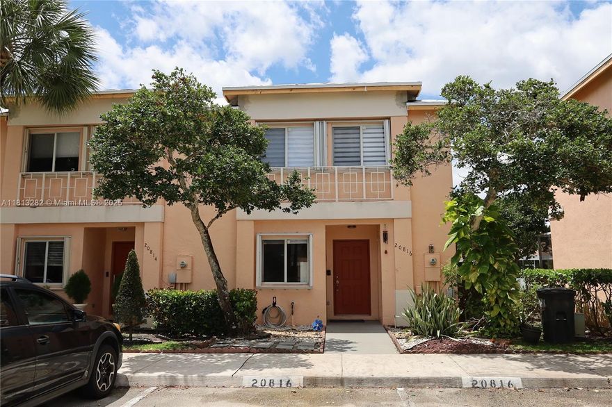 Welcome to this stunning 3-bedroom, 2.5-bathroom corner unit located in a highly sought-after, family-friendly gated community. This well-maintained home features updated flooring throughout, new appliances, and a spacious layout perfect for comfortable living. Enjoy outdoor living year-round with a large, screened and roofed patio overlooking an open backyard, ideal for entertaining or relaxing in privacy. ***NEW ROOF**, Accordion Shutters, Appliances: Whirlpool 24.7 Cu. Ft Refrigerator (Installed October 2025), Microwave (Replaced December 2024),Water Heater (Replaced October 2023), Air Conditioner (Installed June 2023) Parking: 2 assigned parking spaces right in front of the unit, with ample guest parking nearby.