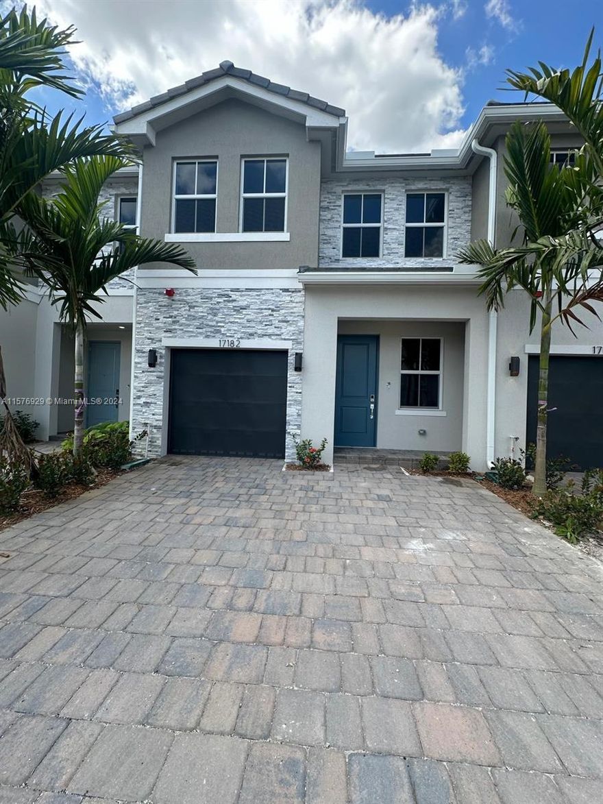 Discover  modern living in Pembroke Pines with this newly constructed townhouse in Merrick Square. Boasting four bedrooms and three bathrooms, this home exudes sophistication and comfort. Its prime location in West Pembroke Pines offers convenient access to I-75, making commuting to Miami and Fort Lauderdale a breeze. Enjoy the luxury of top-rated schools, including public, charter, and private options, just minutes away. With a gourmet kitchen featuring high-end appliances and a spacious layout designed for entertaining, this home is perfect for creating lasting memories with loved ones. Step outside to your private backyard retreat, where you can relax and unwind in tranquility. Use Showing Assist to schedule your visit! Washer, Dryer & Blinds are installed.**NO HOA APPROVAL REQUIRED**