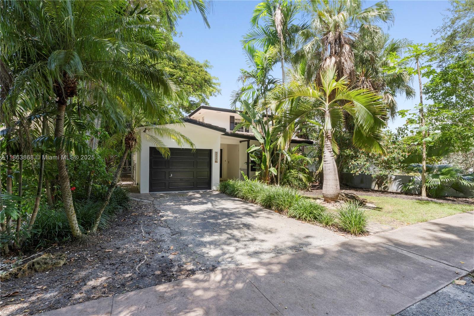 Welcome to this charming Coral Gables residence on a tree-lined street featuring 3 bedrooms, 2 baths, and ±1,700 SF of living space. The interior offers spacious living and dining areas plus an updated kitchen with stainless steel appliances and ample cabinetry. The primary suite boasts generous closets and a remodeled en-suite bath, while additional bedrooms provide flexibility for family, guests, or office. Outdoors, enjoy a private patio shaded by mature trees and a one-car garage. Ideally located near Merrick Park, UM, Miracle Mile, and top-rated schools, this home blends Gables charm, comfort, and convenience.