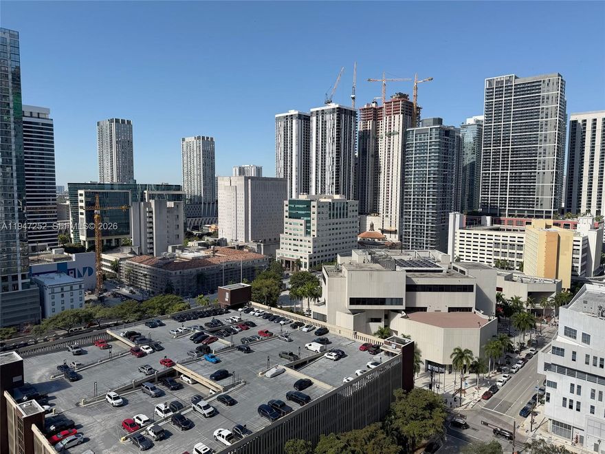 Experience elevated urban living with stunning city views, soaring 10-foot ceilings, floor-to-ceiling impact windows, and sleek concrete floors throughout. The modern kitchen features stainless steel appliances, and the unit includes an in-unit washer and dryer for added convenience.

Residents enjoy a full suite of resort-style amenities, including a rooftop pool, ground-floor lap pool, fitness center, sauna, steam room, plunge pool, 24-hour concierge, and an elegant club room. Ideally located near Brickell, Wynwood, Midtown, and Miami Beach, with the MetroMover station just across the street offering effortless access to Miami International Airport and Brightline.

Short-term rentals are permitted with a minimum 30-day lease, allowing up to 12 leases per year—making this an exceptional opportunity for both end users and investors.