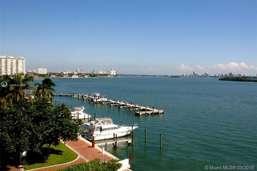 Two Bedroom, two bath condo with pleasant view of gardens, trees and water. Kitchen and bathrooms are upgraded. Tile and wood floors .  Custom lighting .  Total move in condition.